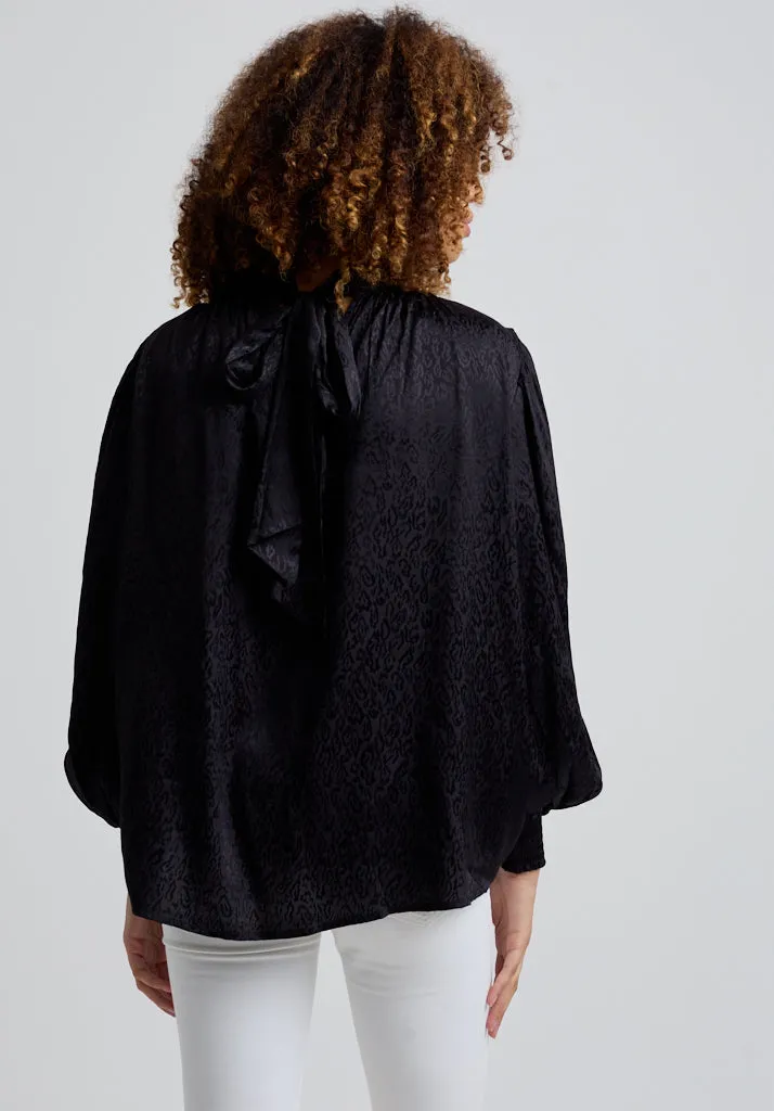 Molly Turtle Neck Animal Blouse In Black