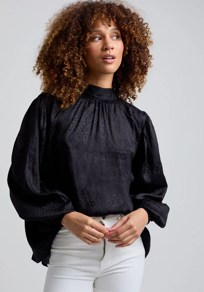 Molly Turtle Neck Animal Blouse In Black